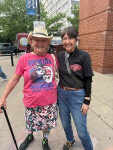 Two women posing closely together
